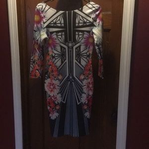 Geometric floral body on dress.